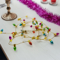 Preview: Geschenkband, Faux light Kordel in gold mit farbigen kleinen Tannenbaumlichter, style